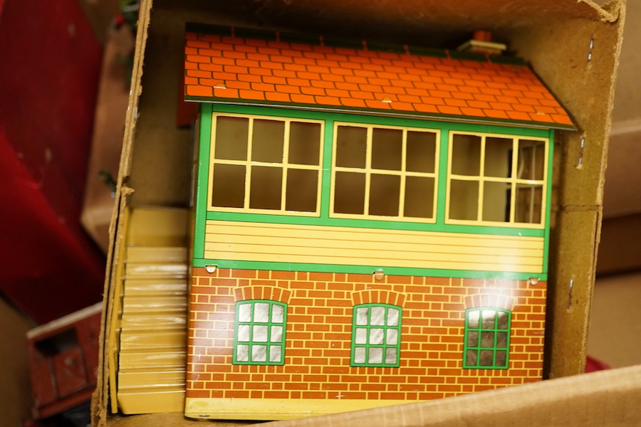 A collection of Hornby clockwork tinplate 0 gauge railway, including; two LNER 0-4-0 tender locomotives, both 1842, (No.501), together with six 4-wheel wagons and coaches, a boxed No.3 Station, level crossing, signal cab